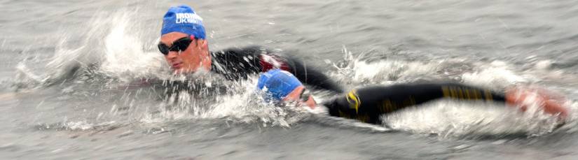 Why does my calf cramp towards the end of an open water swim?