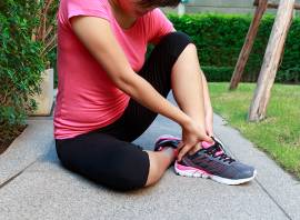Why do my ankles and legs swell up after racing an Ironman triathlon?
