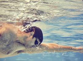 How does swimming tone the body?