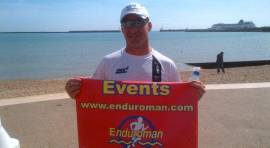 Bayliss finishes the run stage of the Enduroman Arch to Arc