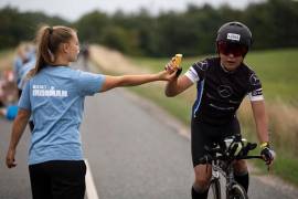 How can I make sure I take on enough fuel during the bike and run legs of a triathlon?