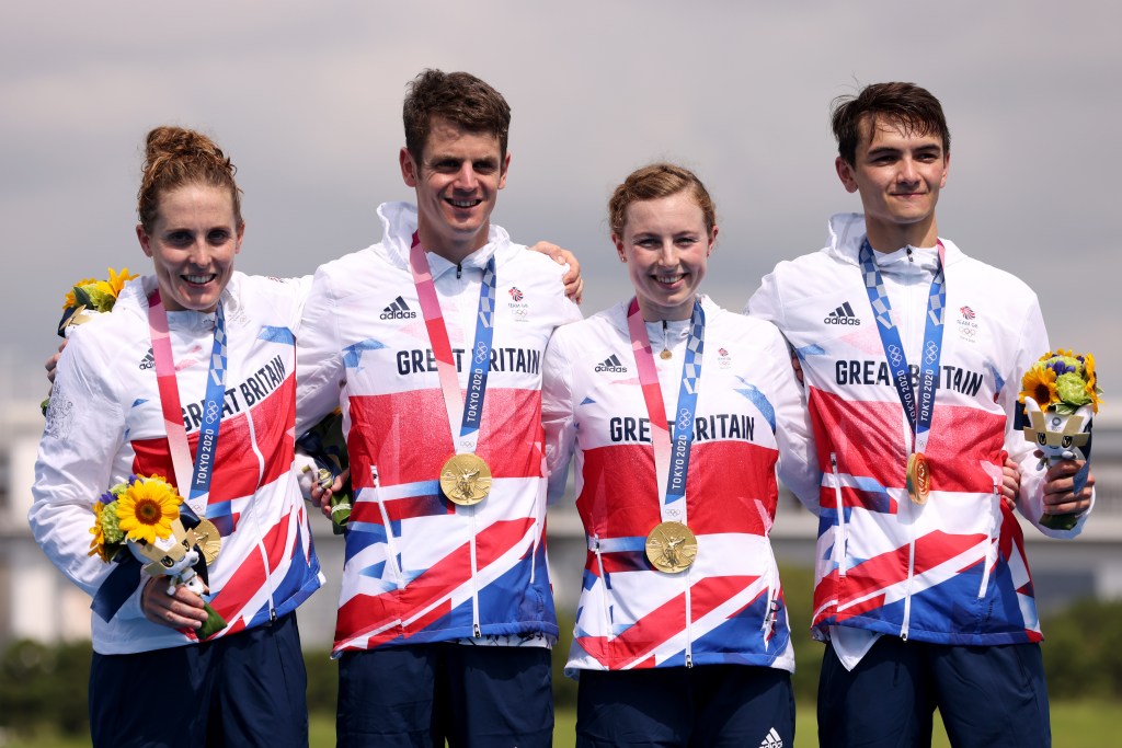 Triathlon - Olympics: Day 8 TOKYO, JAPAN - JULY 31: (L-R) Jessica Learmonth, Jonathon Brownlee, Georgia Taylor-Brown and Alex Yee of Team Great Britain pose with their gold medals on the podium during the medal ceremony following the Mixed Relay Triathlon on day eight of the Tokyo 2020 Olympic Games at Odaiba Marine Park on July 31, 2021 in Tokyo, Japan. (Photo by Jamie Squire/Getty Images)