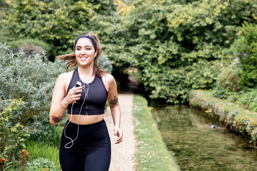 Woman running and listening to an audiobook