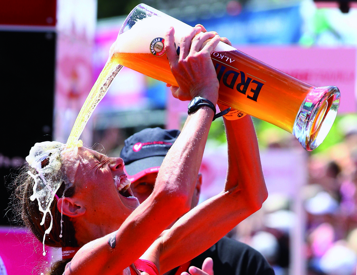 Challenge Roth ROTH, GERMANY - JULY 10: Chrissie Wellington of England enjoys a glas of beer after winning the Challenge Roth Triathlon with a new long distance world record on July 10, 2011 in Roth, Germany. (Photo by Alexander Hassenstein/Getty Images for Challenge Roth) *** Local Caption *** Chrissie Wellington