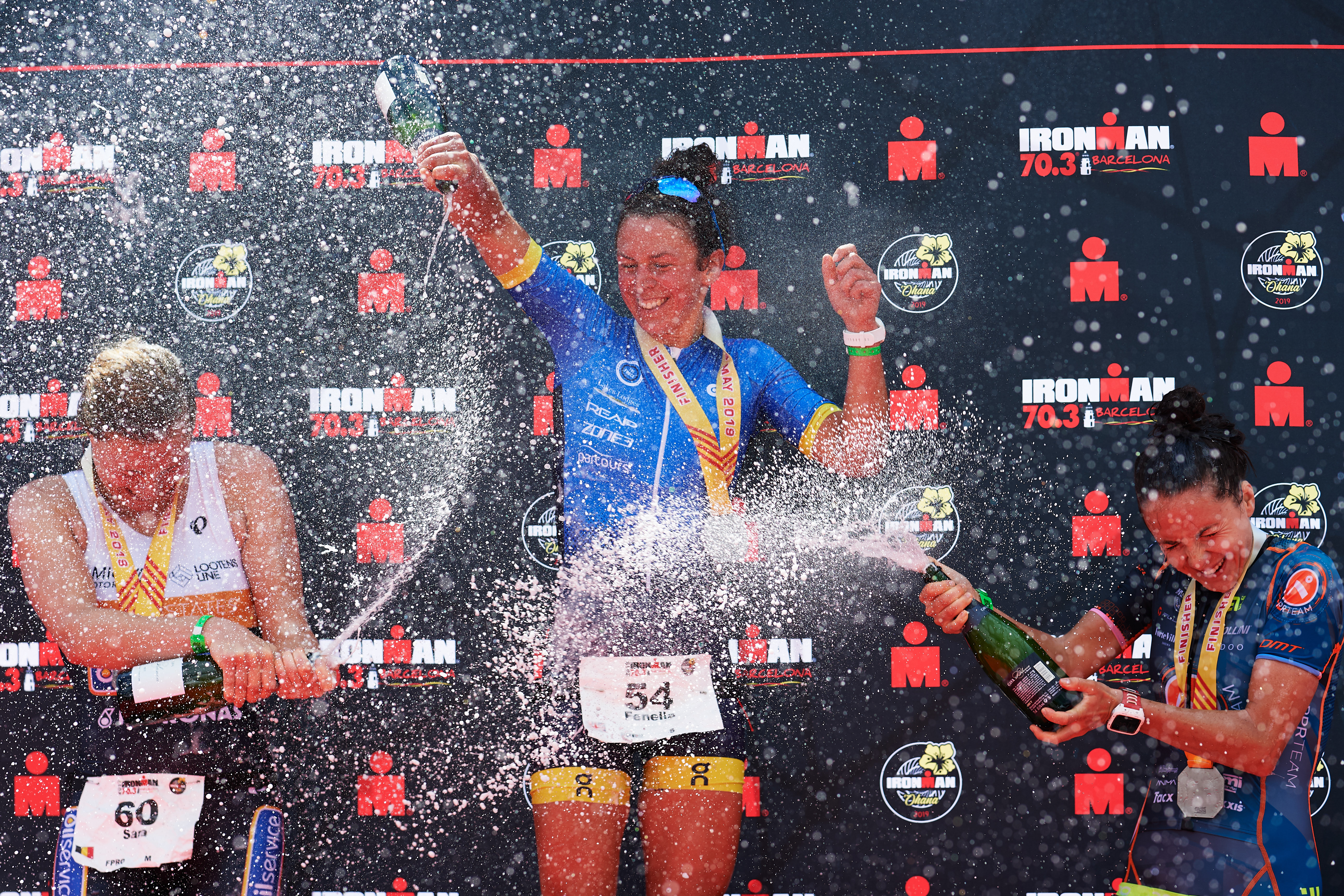IRONMAN 70.3 Barcelona CALELLA, SPAIN - MAY 19: Fenella Langridge (C) of Great Britain in 1st place, Sara Van De Vel (L) of Belgium in 2nd place and Gabriella Zelinka (R) of Hungary in 3rd place celebrate their results after finishing IRONMAN 70.3 Barcelona on May 19, 2019 in Calella, Spain. (Photo by Alex Caparros/Getty Images for IRONMAN)