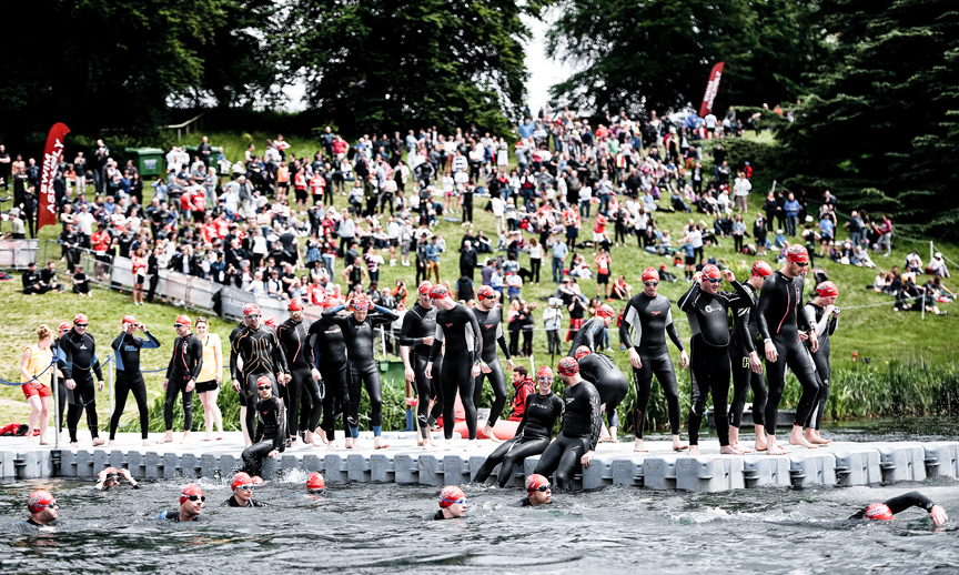 blenheim-palace-swim-start Athletes warm up in the water ahead of the Blenheim Palace Triathlon