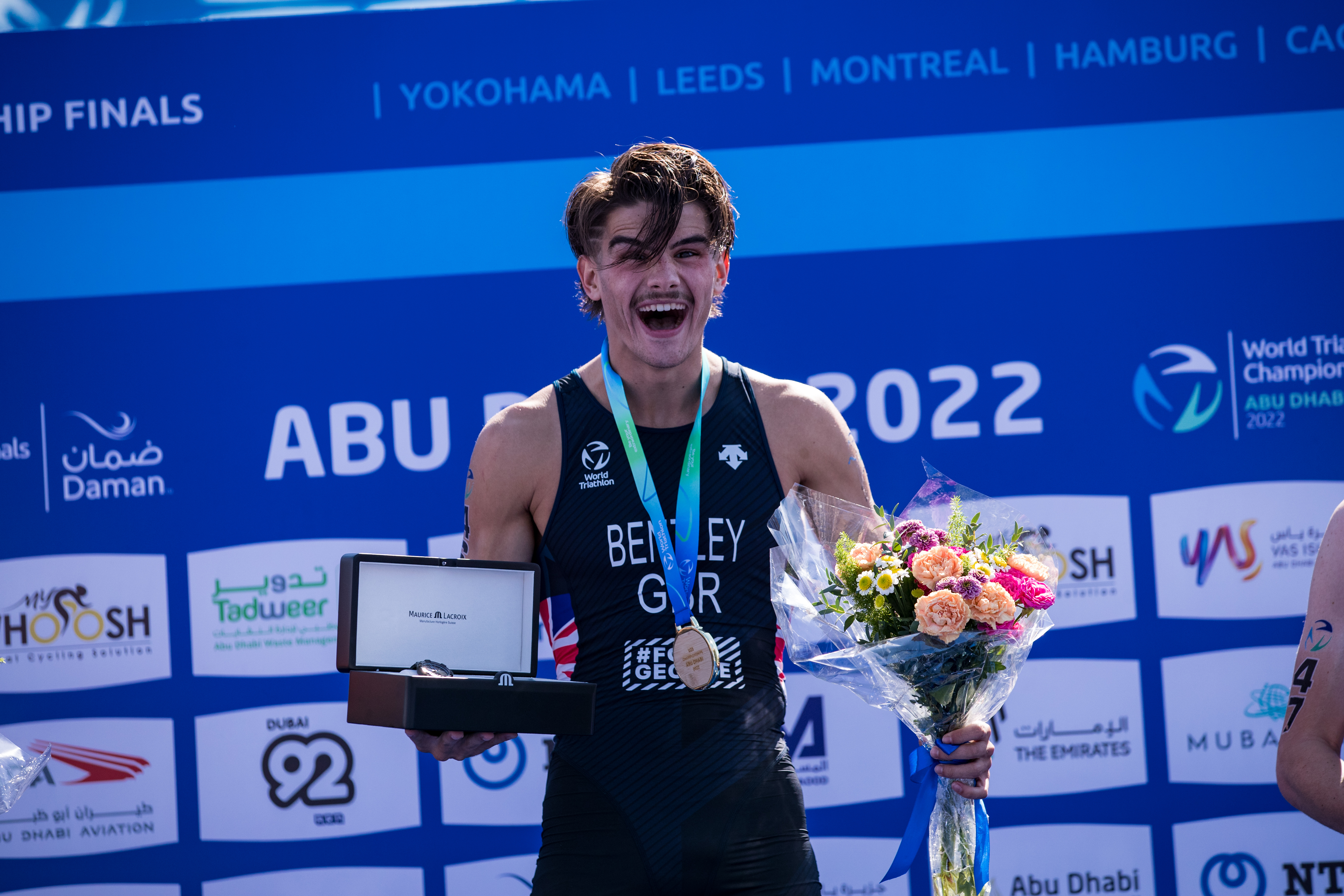 connor-bentley-u23-worlds-abu-dhabi-2022 Connor Bentley looking surprised but very happy on the top step of the podium at the 2022 U23 World Champs, Abu Dhabi