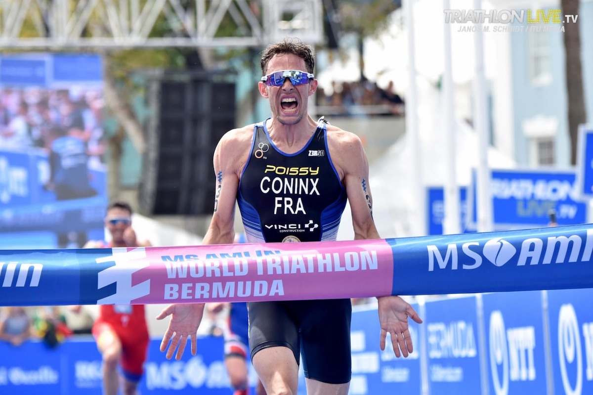 dorian-coninx-bermuda-wts-2019 Dorian Coninx runs up to the finisher's tape with mouth open wide in triumph having won his first World Triathlon Series race in Bermuda, 2019
