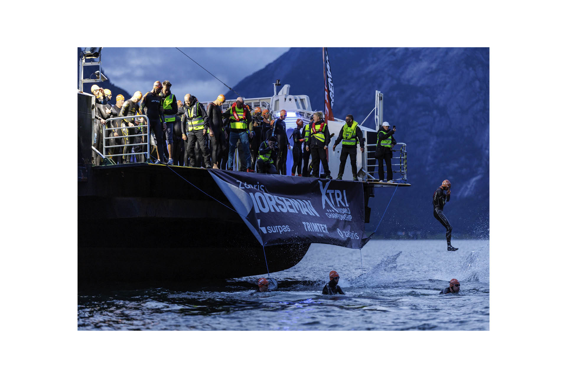 Norseman2 Athletes jump from the ferry for the start of the 20th Zalaris Norseman race. Image credit: Sylvain Cavatz / Zalaris Norseman
