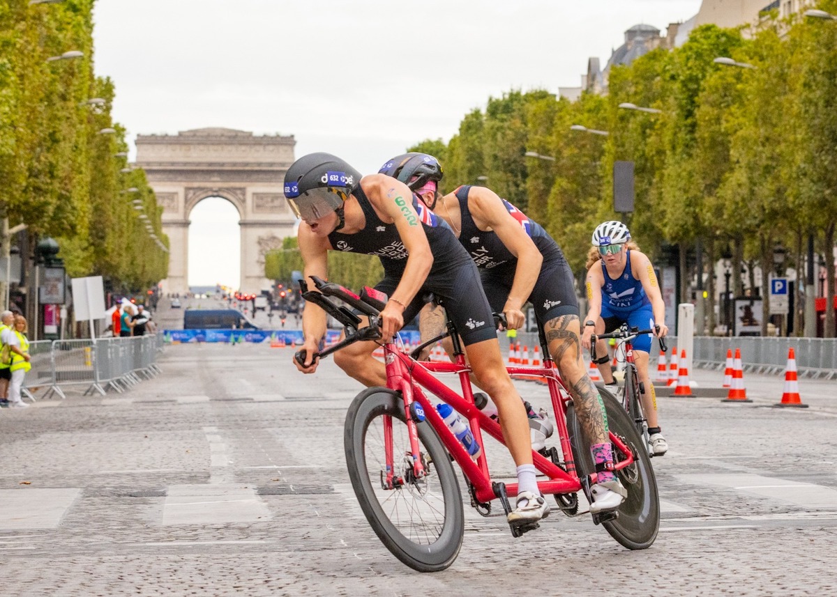 oscar-kelly-charlie-harding-paris-test-event GB PTV1 paratriathlete Oscar Kelly and guide Charlie Harding race over the hallowed cobbles of the Champs-Élysées at the Paris Paralympics Test Event