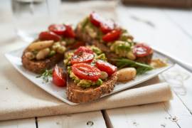 Tomatoes, avocado and garlic on toast 