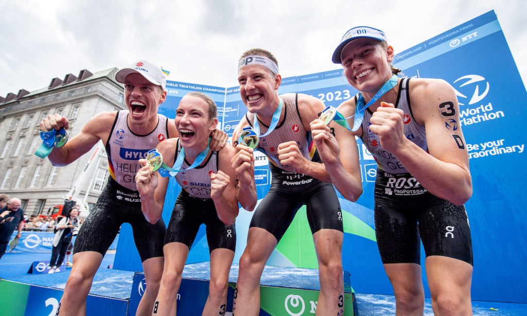 L-R: Germany's Tim Hellwig, Annika Koch, Simon Henseleit and Laura Lindemann celebrate winning the 2023 Mixed Relay Championship at the World Triathlon Hamburg race