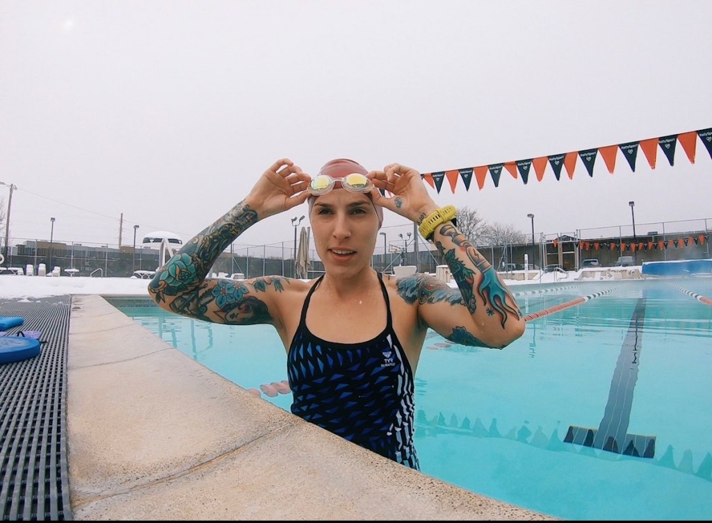 Cori James tattoo artist in a swimming pool