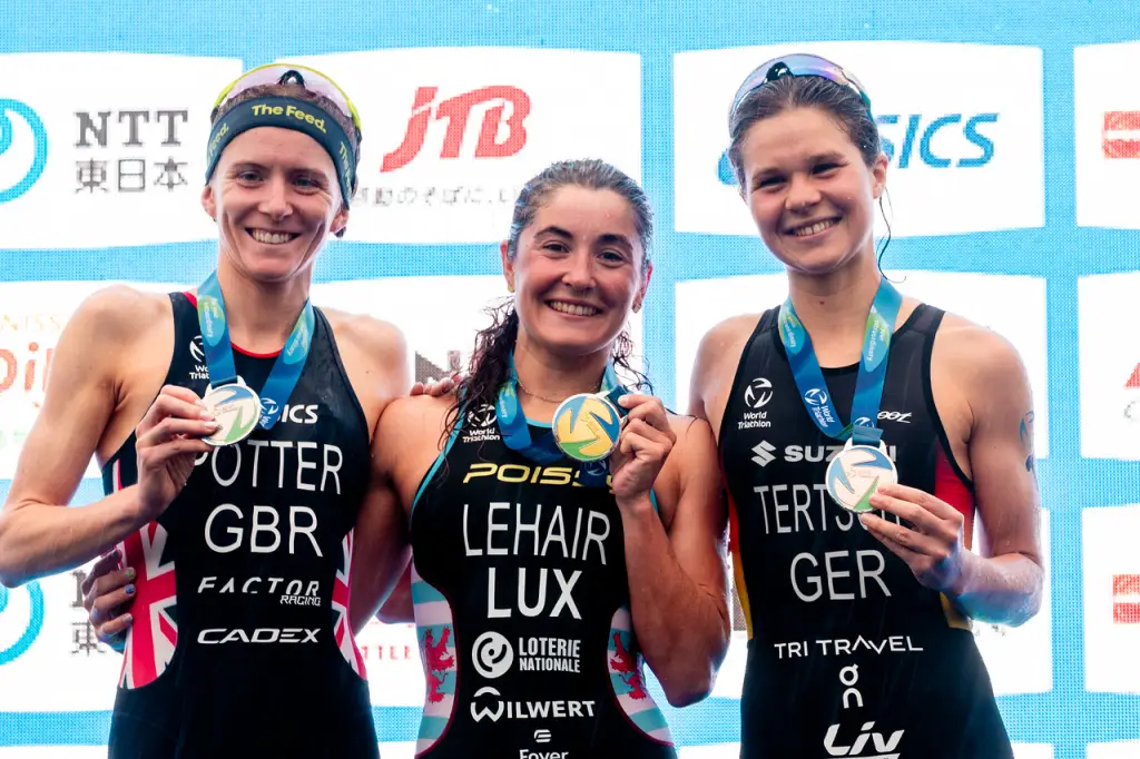 Yokohama WTCS winner Jeanne Lehair is flanked by Beth Potter and Lisa Tertsch on the podium.