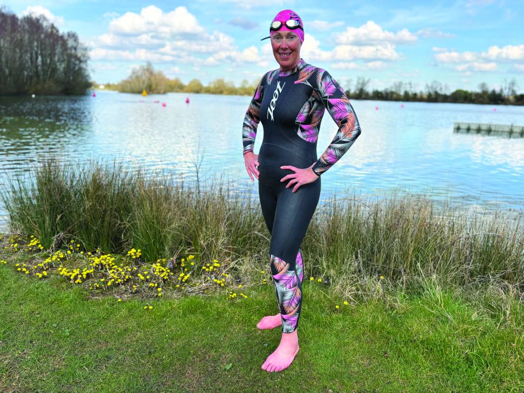 athlete wearing zoot kona 2.0 by a lake