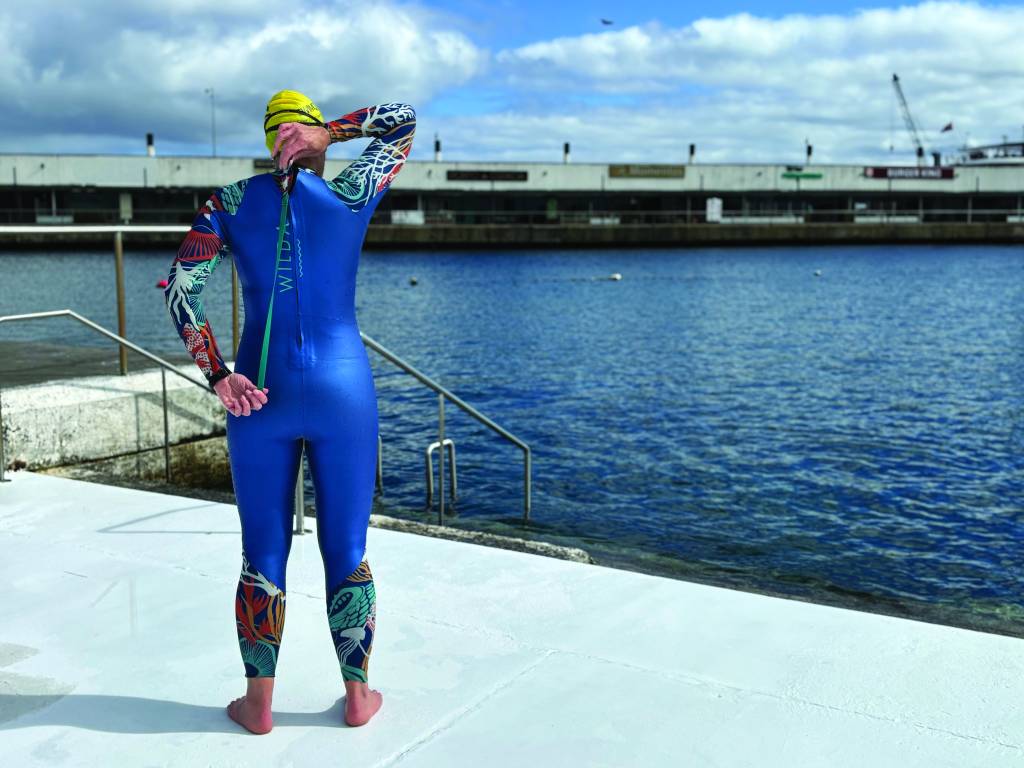 woman wearing Wilda Dart wetsuit rear view