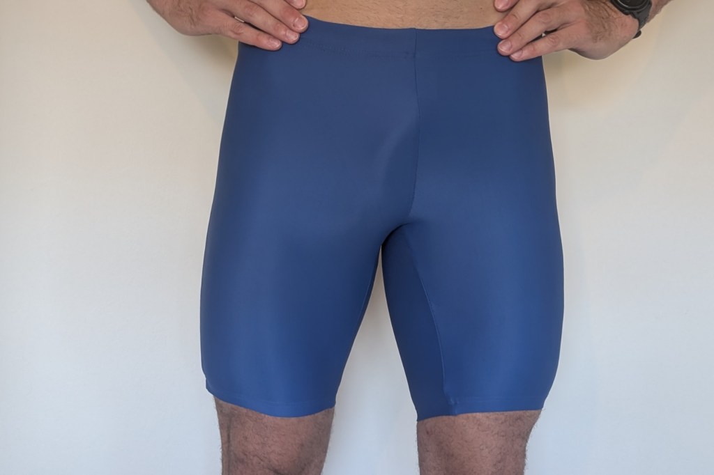 Man wearing bright bluw swim jammer