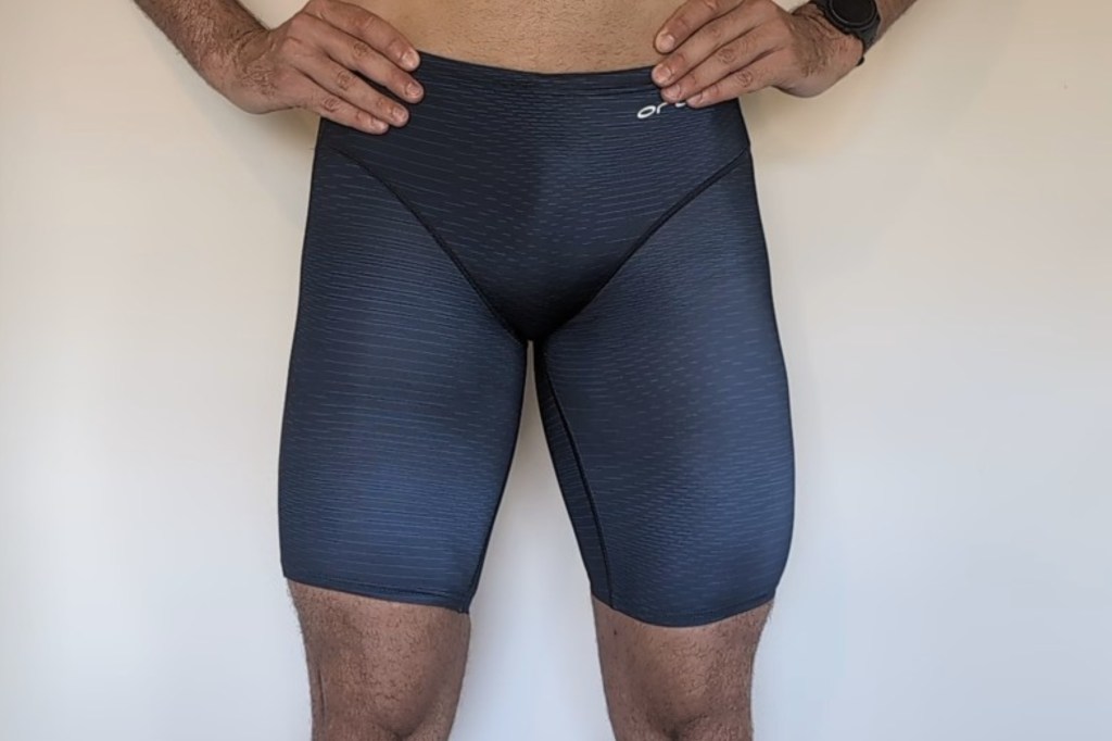 Man wearing dark blue swim jammer