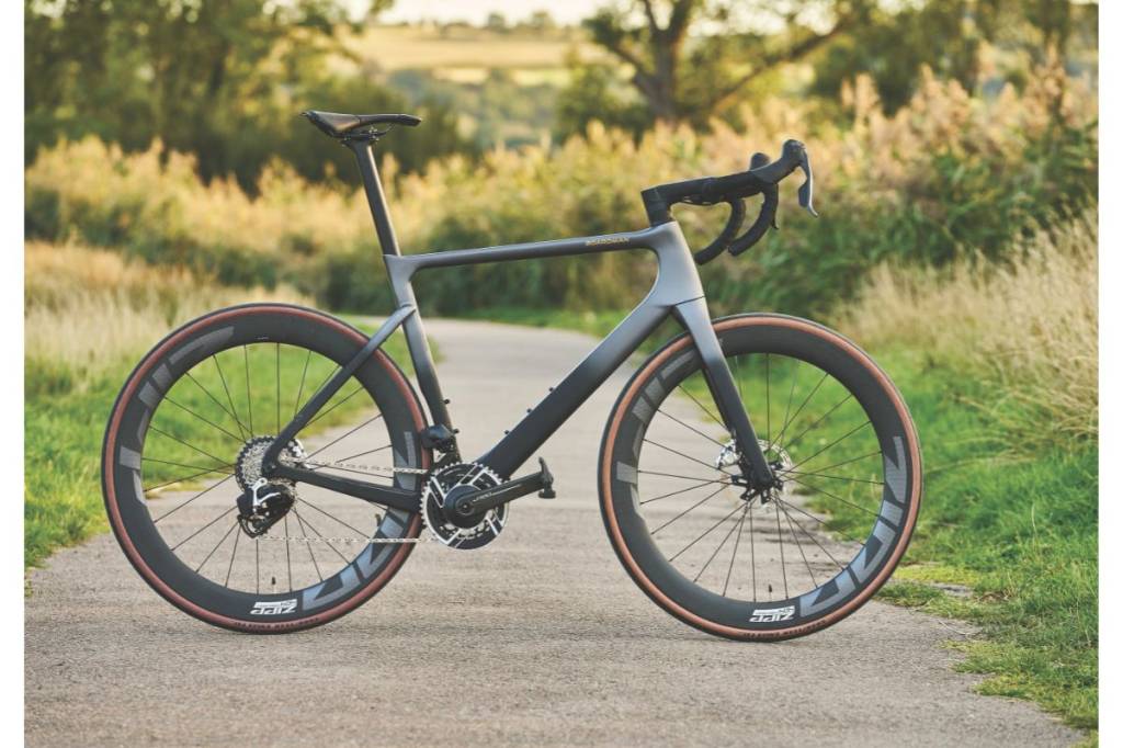 Black and grey road bike side-on shot on path