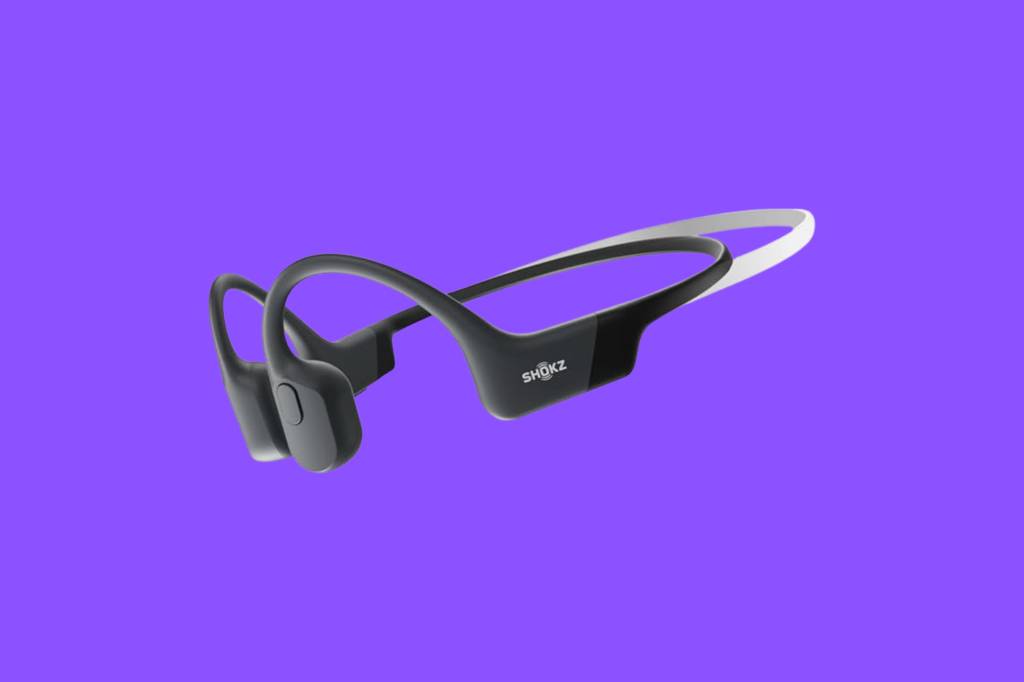 Shokz bone-conduction headphones on purple background