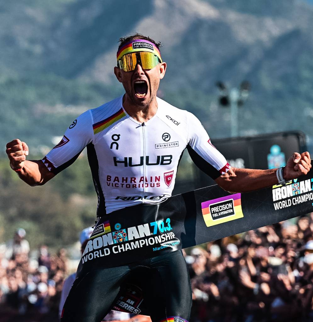 An elated Jelle Geens takes the tape to retain his title in Spain. Pic credit: IRONMAN