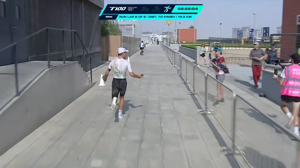 A confused Wilde asks around for explanations during the race as he starts to catch up to competitors