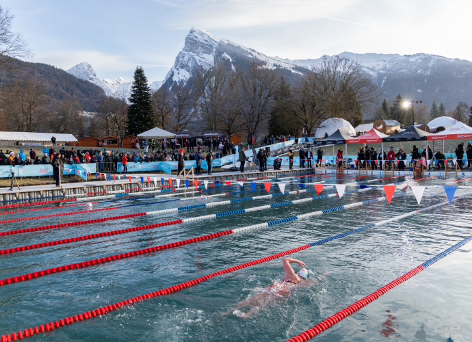 Cold water swimming pool in front of snow-capped mountains