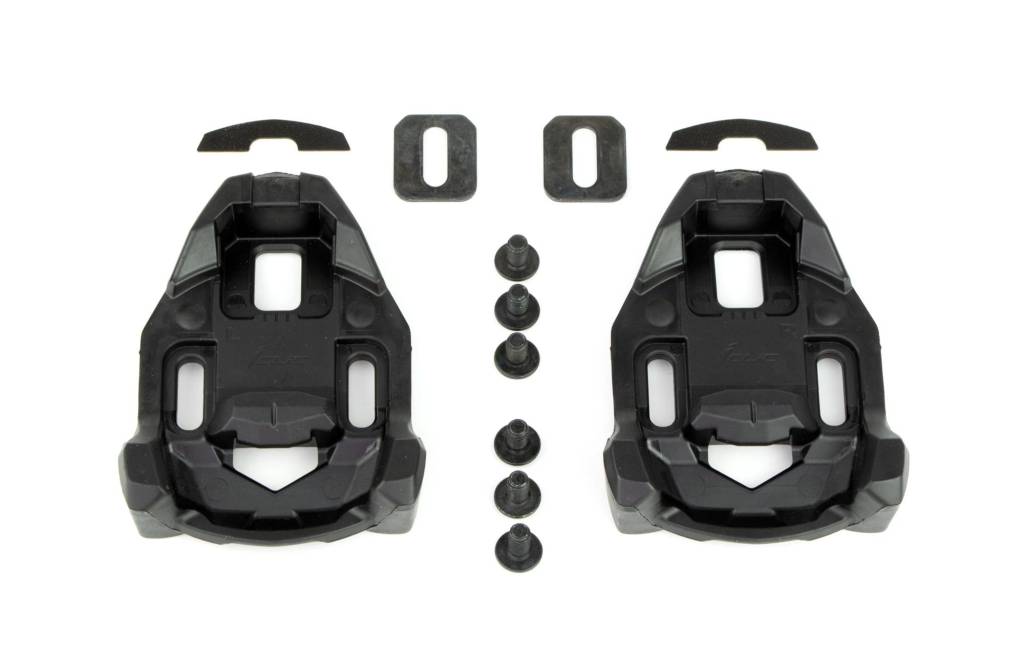 Black road cycling cleats and bolts on white background