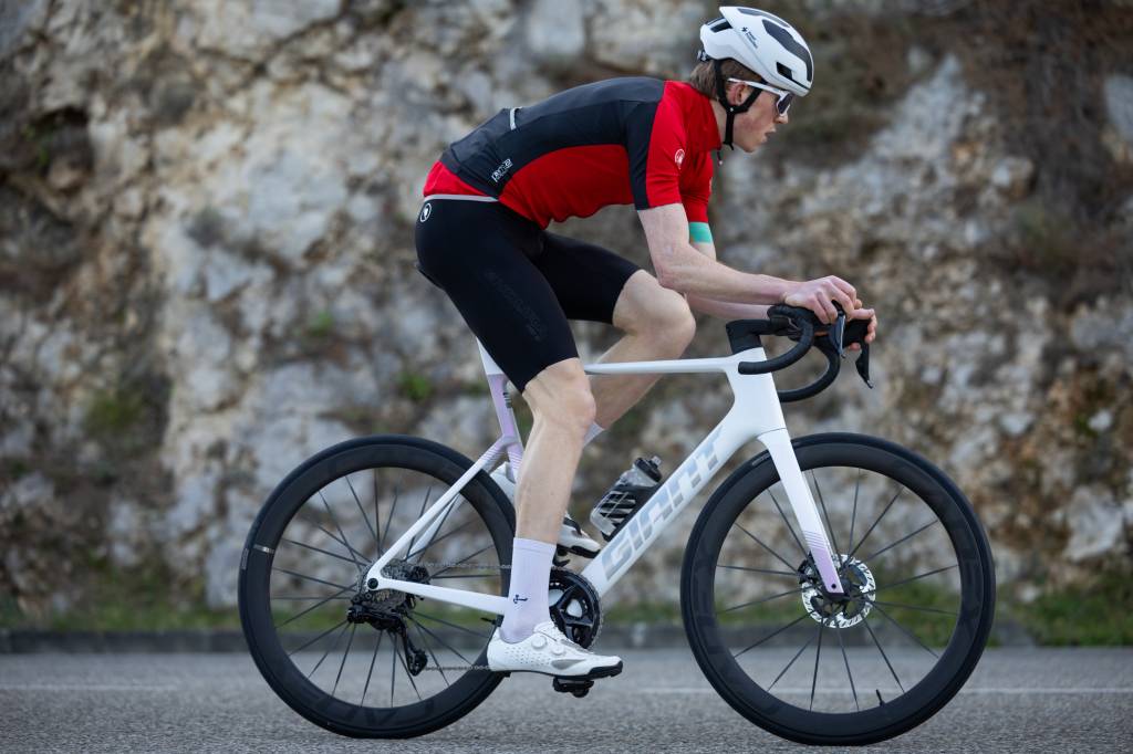 Male cyclist riding Giant road bike and wearing Endura Pro SL long leg bib shorts