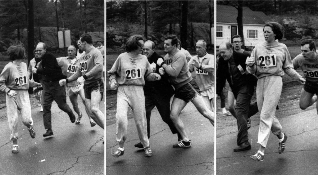 A woman, listed only as K. Switzer of Syracuse, found herself about to be thrown out of the normally all-male Boston Marathon when a husky companion, Thomas Miller of Syracuse, threw a block that tossed a race official out of the running instead, April 19, 1967 in Hopkinton, Mass