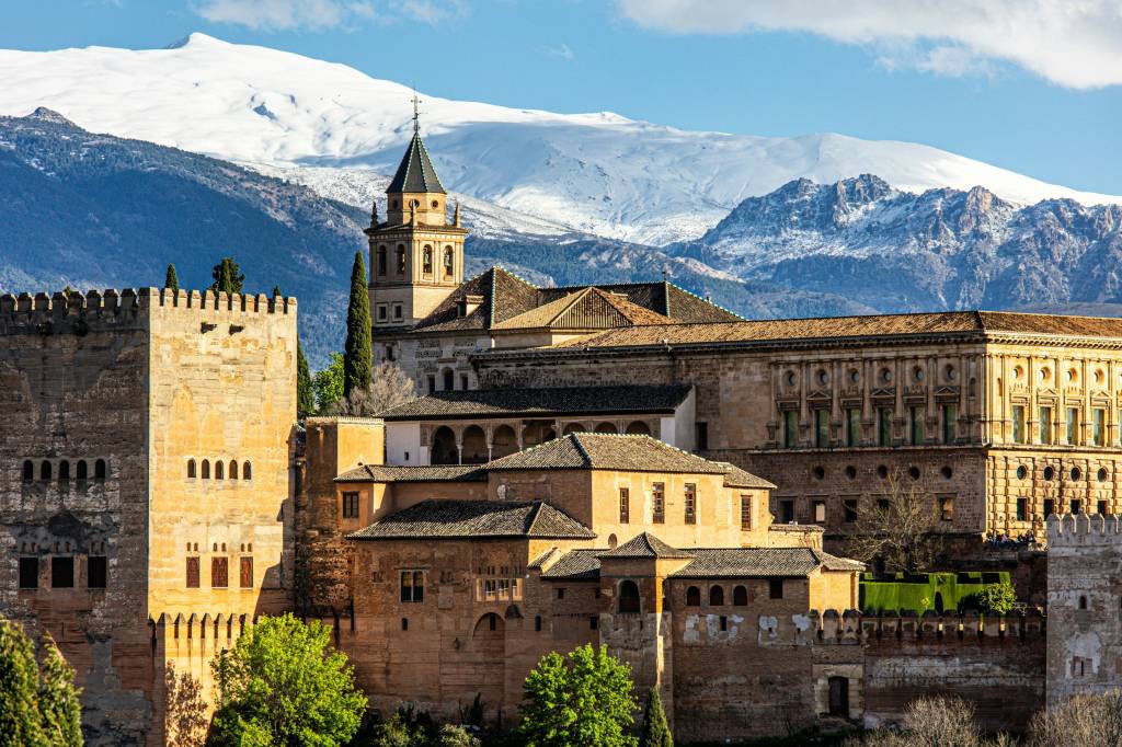 Spanish city with mountain view in background