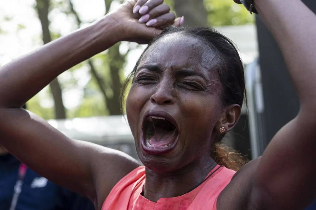 Tigst Assefa celebrates winning the 2026 London Marathon and setting world record