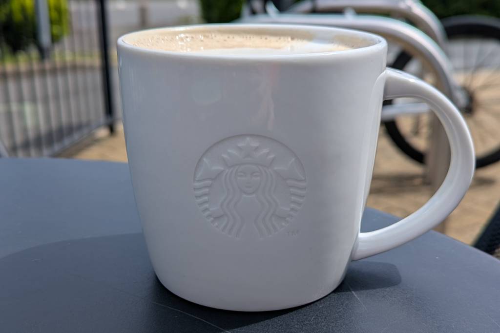 Close-up of white starbucks coffee mug