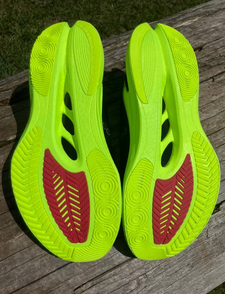 Underside view of a pair of running shoes