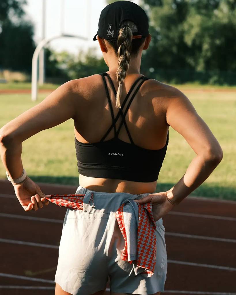 A woman wearing Sealskinz running shorts