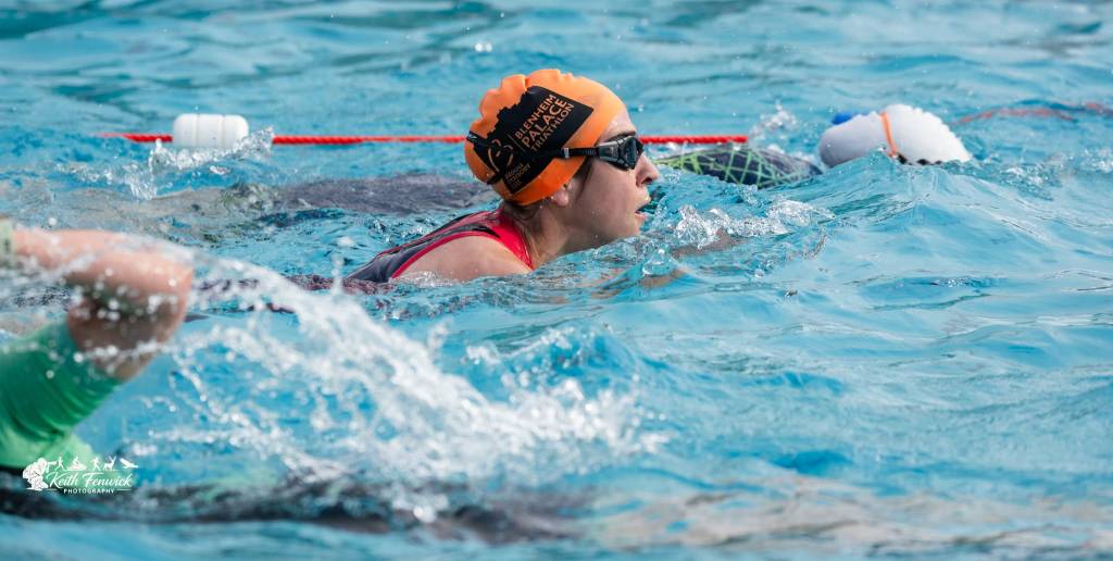 Women swimming in a pool during a triathlon