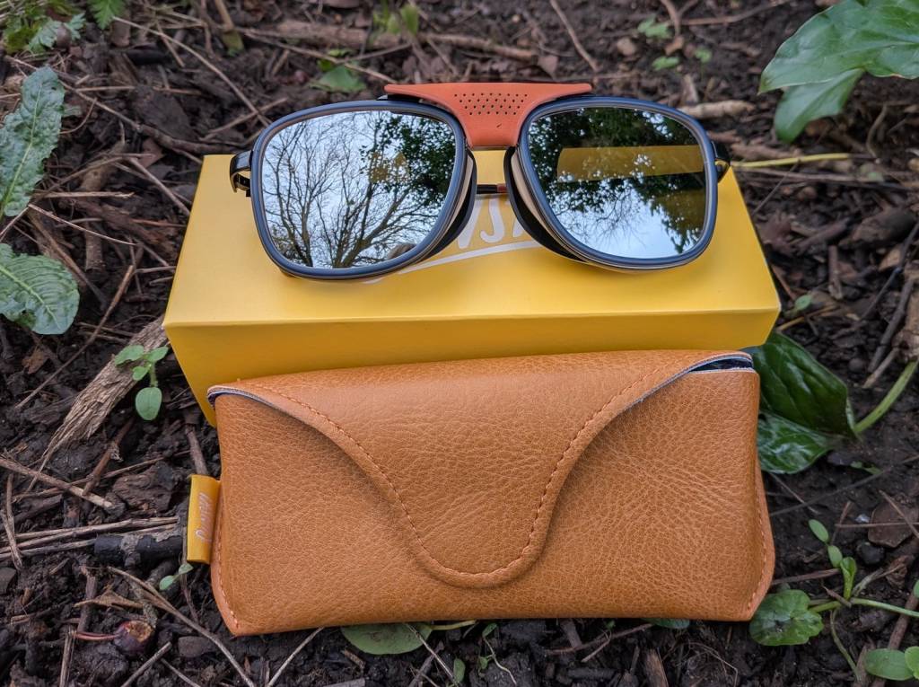Product shot of Sunski glasses and case