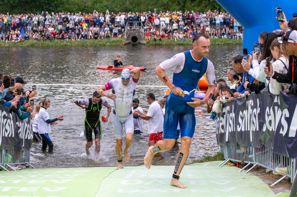 The leading men exit the water after the 3.8km swim. Pic credit: Challenge Roth